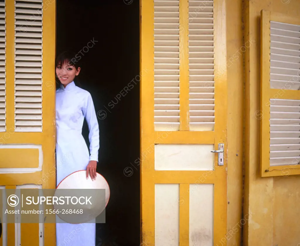 Vietnamese woman in traditional dress, Ho Chi Minh City. Vietnam