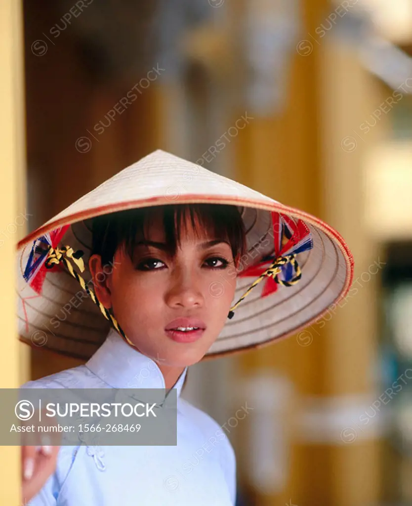 Vietnamese woman in traditional dress, Ho Chi Minh City. Vietnam