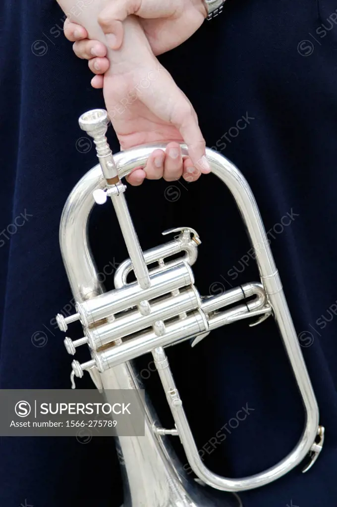 Trumpet player taking spare time.