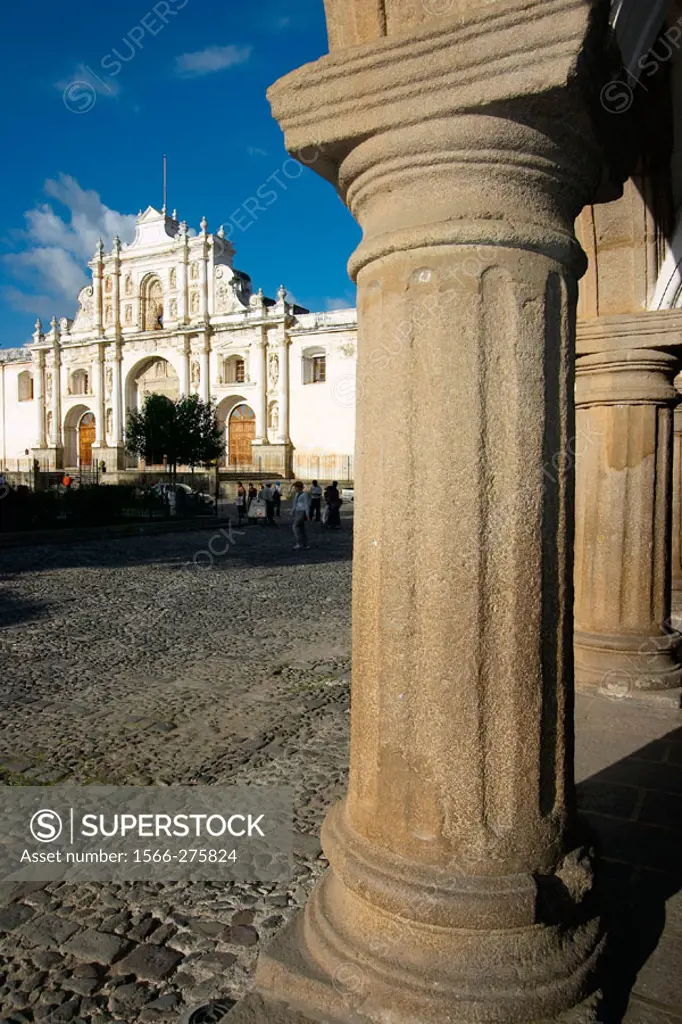 Columns from Captains Palace and Santiago´s Cathedral at the background. Antigua Guatemala. Sacatepéquez department. Guatemala