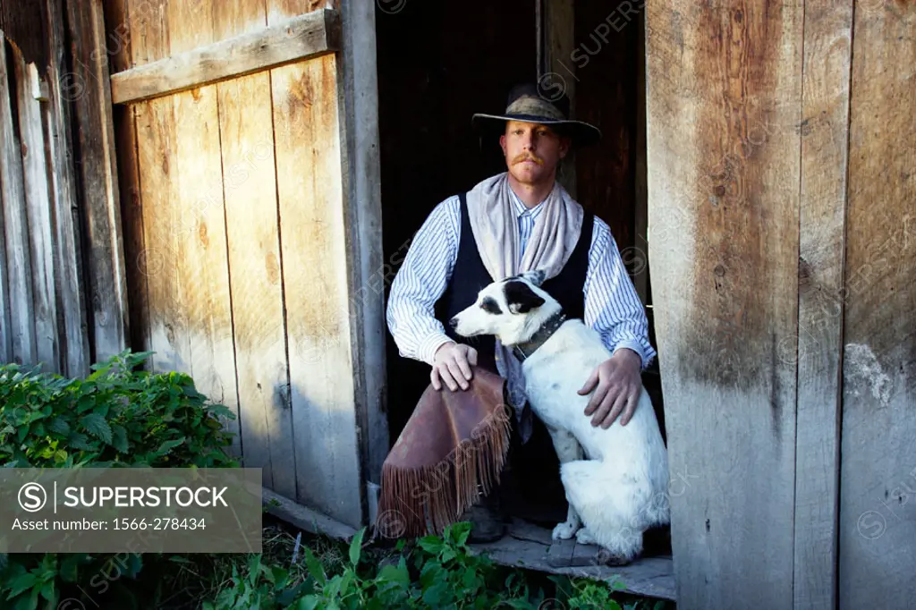 Cattleman with border collie. Ponderosa Ranch. Seneca. Oregon . USA