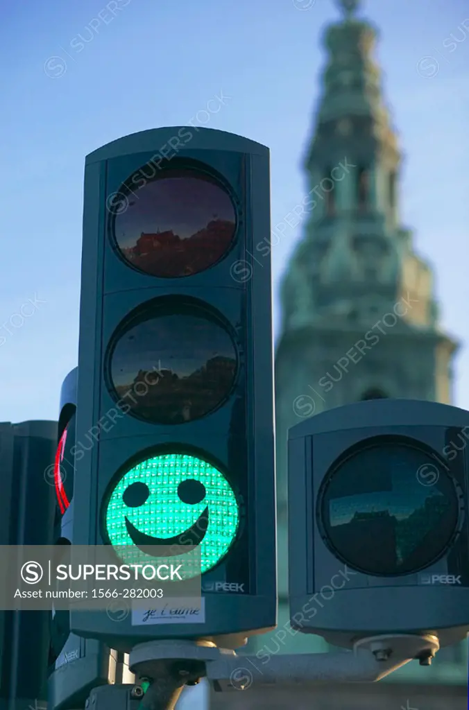 Green traffic light decorated with a funny face, Copenhagen. Denmark