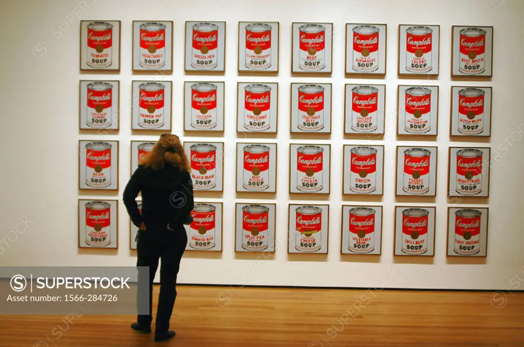 Woman in museum admiring Warhol´s Campbell´s Soup Series.