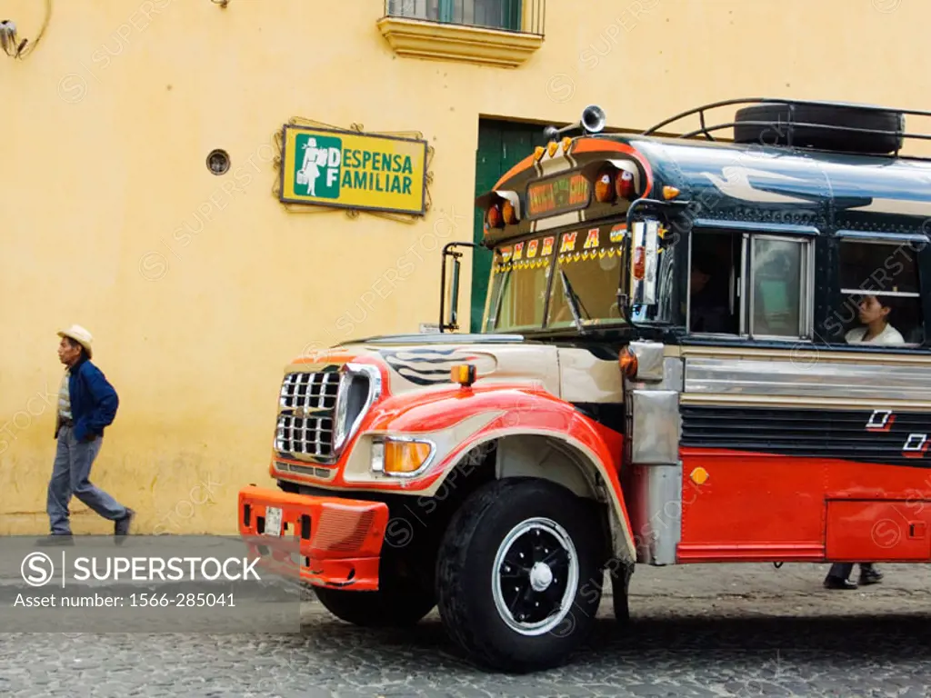 Former American school buses, which now serve as  Guatemala´s local and long distance buses, some with old markings from their past lives in America, ...