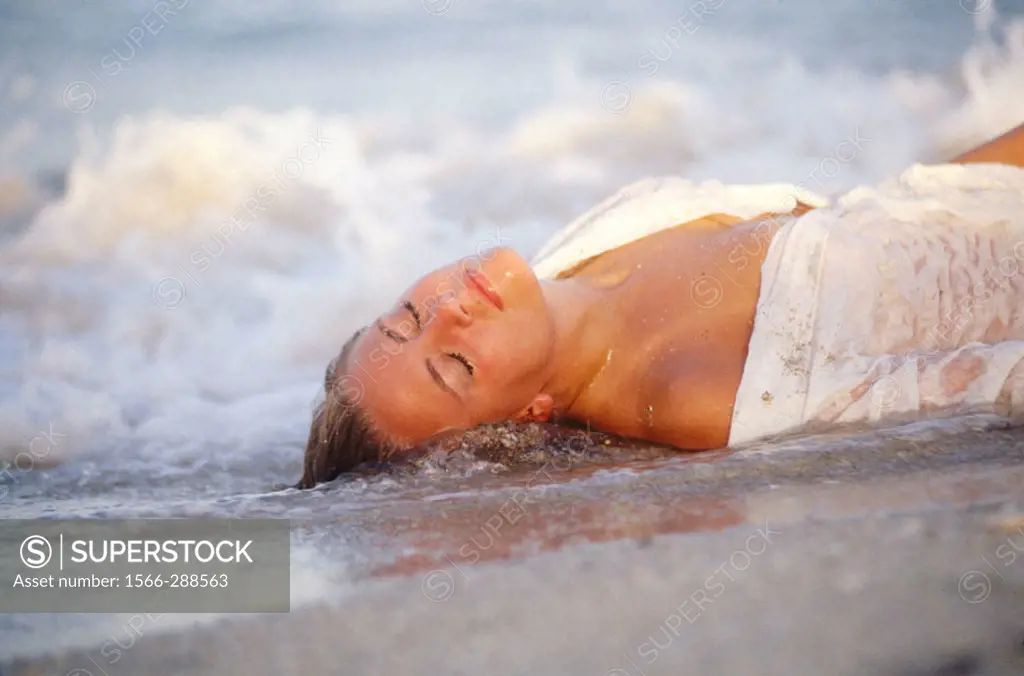 sensual girl lying in the surf