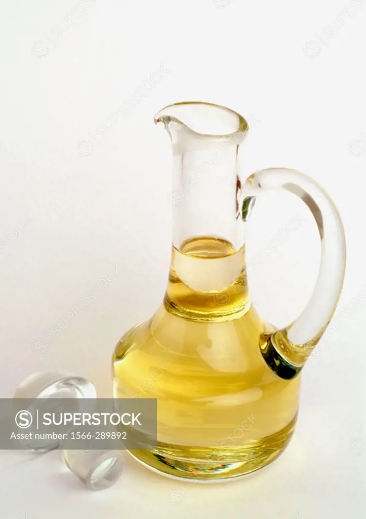 Edible oil in a glass carafe.