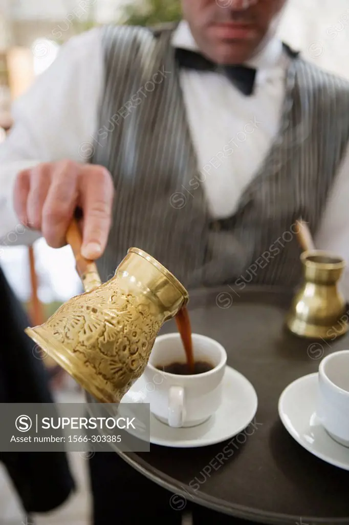 Pouring Turkish coffee. Kerak. Kingdom of Jordan