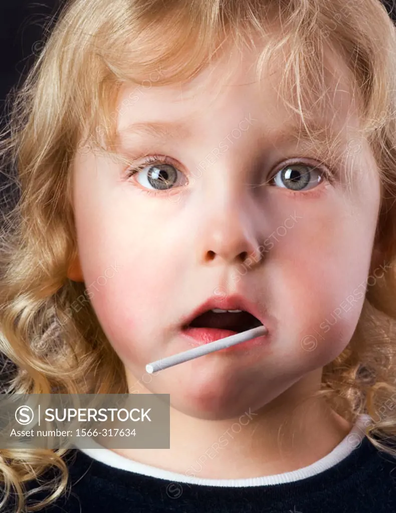 Little girl eating a sucker