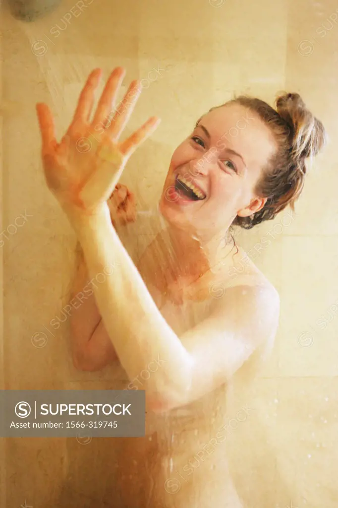 Nude woman in shower