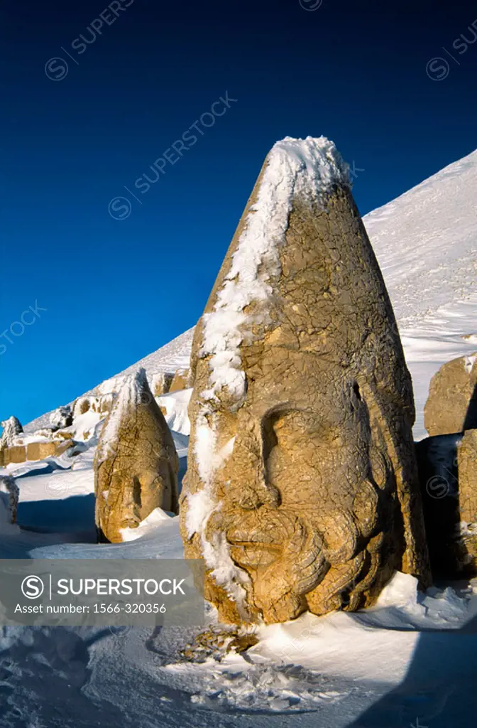 Colossal heads of Herakles and Apollo, remains of the tomb-sanctuary of King Antiochus Theos in the West terrace of Nemrut Dag (Mount Nemrut, 2150 m) ...