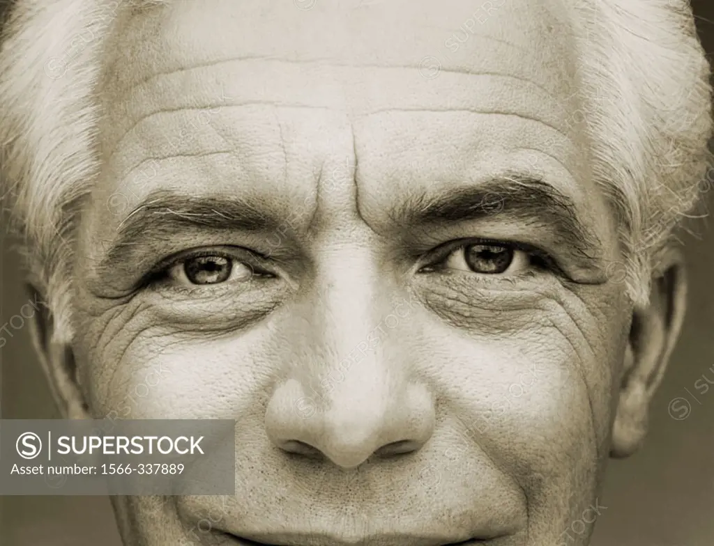 Sepia of close-up of 60 year old Caucasian man, including nose, eyes and forehead