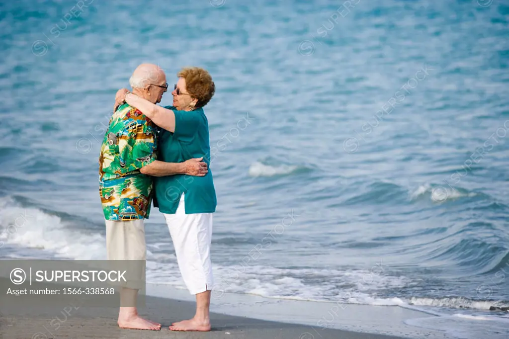Senior couple hugging at the beach