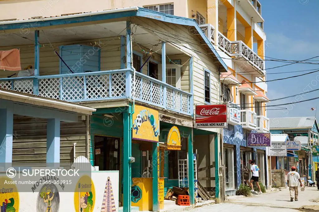 BELIZE San Pedro on Ambergris Caye   Restaurants and stores along street in town, pedestrian traffic