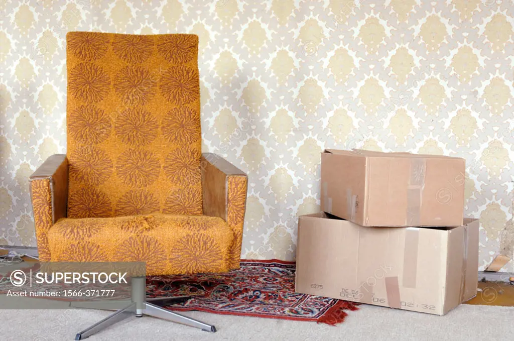Armchair and move cardboards, Saxony, Germany.