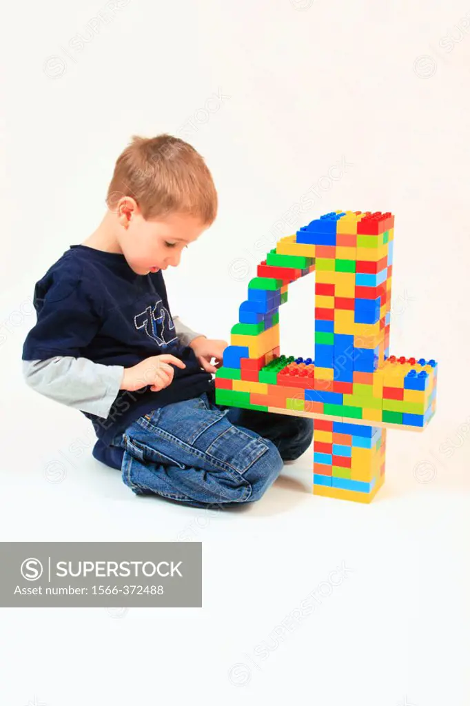 boy playing with toy, Lego, on his fourth birthday,  Studio, Oetwil am See, Zuerich, Switzerland,
