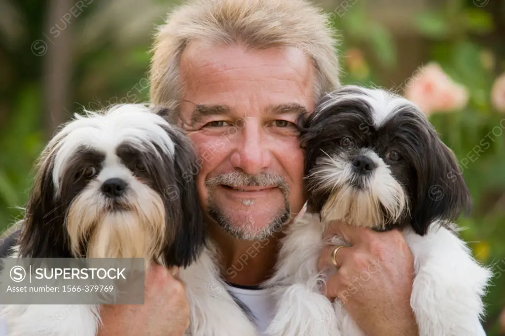 Man holding his two pet dogs