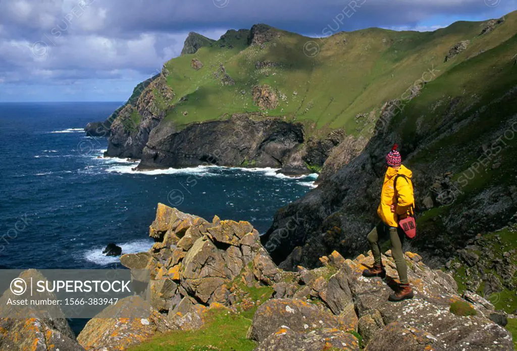 St Kilda, World Heritage Site, tourist on wild cliff edge, Scotland