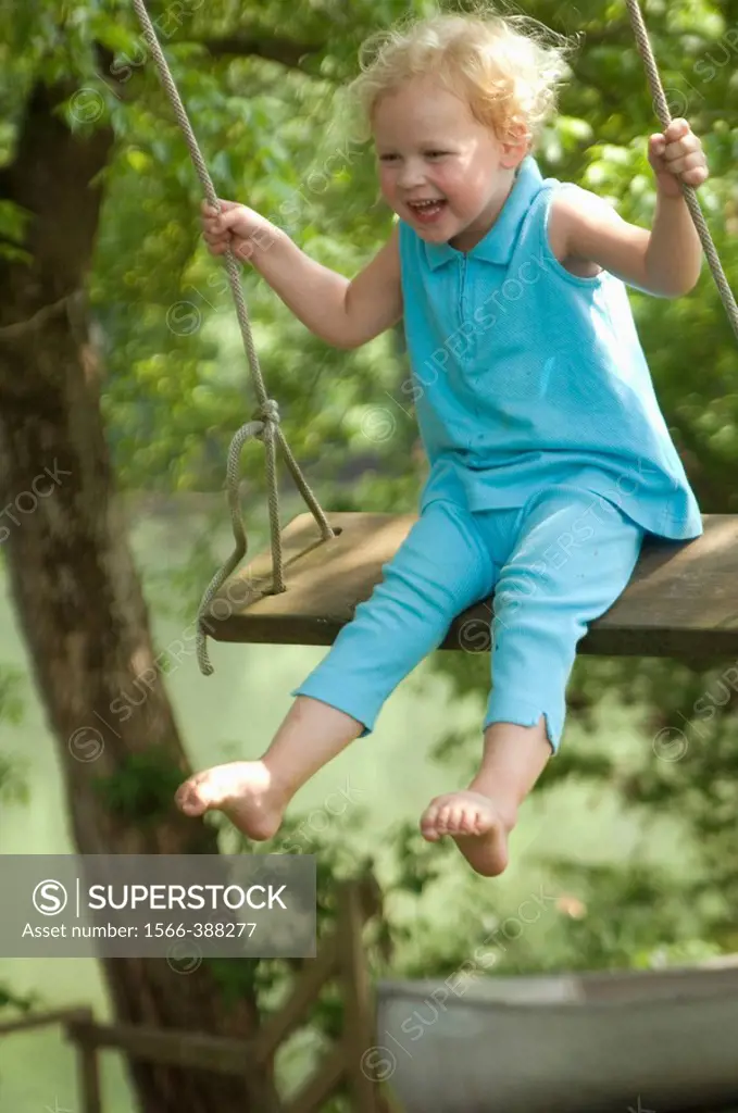 young girl swinging and laughingGreenbrier River, WV