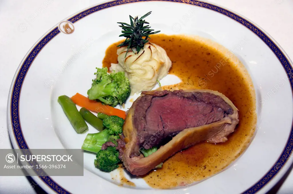 Beef Wellington dinner with vegetables and duchess potatoes on the Holland America cruise ship Ryndam.
