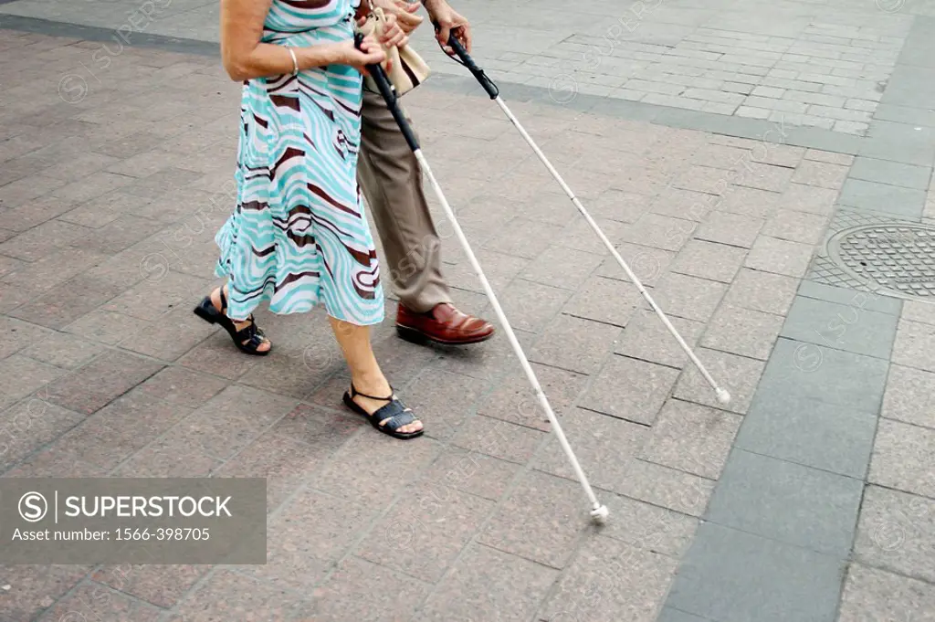 Blind people walking in the street