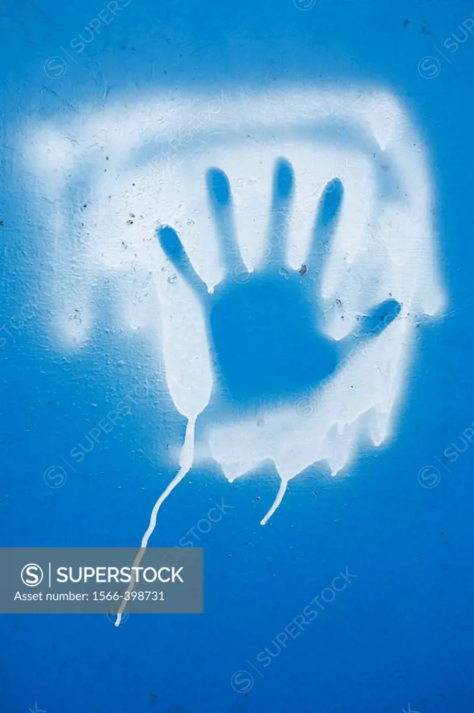 Human hand, painted on blue background, Khust, Ukraine