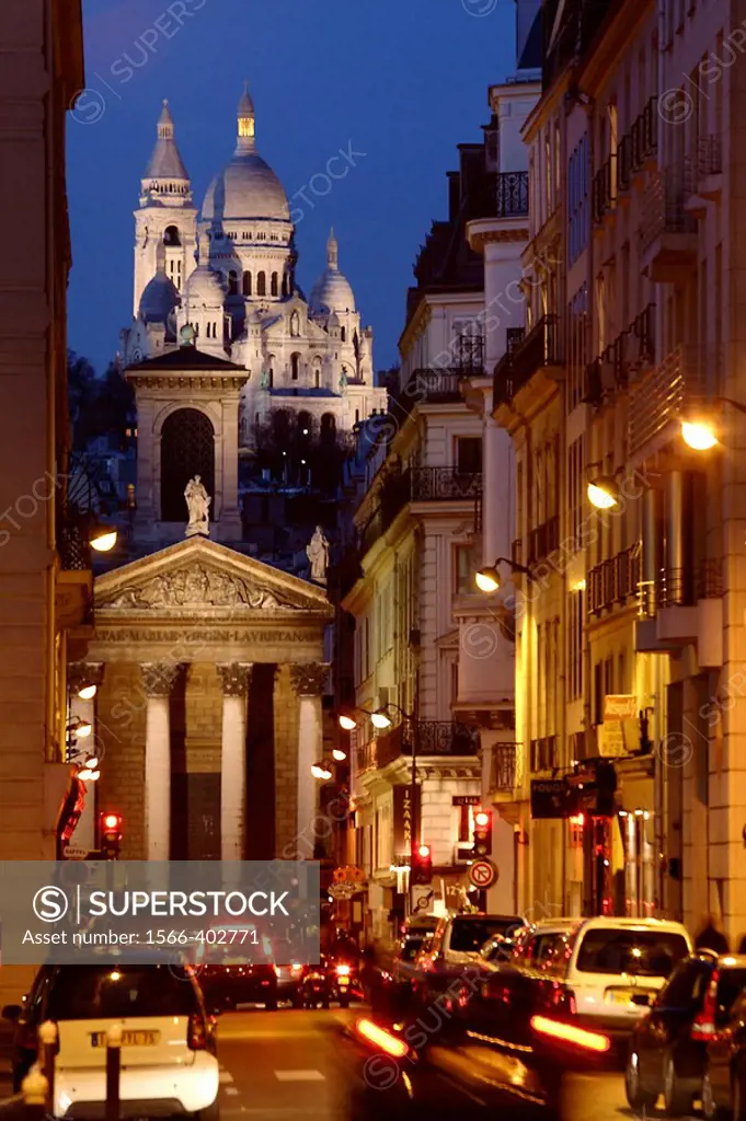 The night view of Sacre-Coeur Church from a street. Paris. France