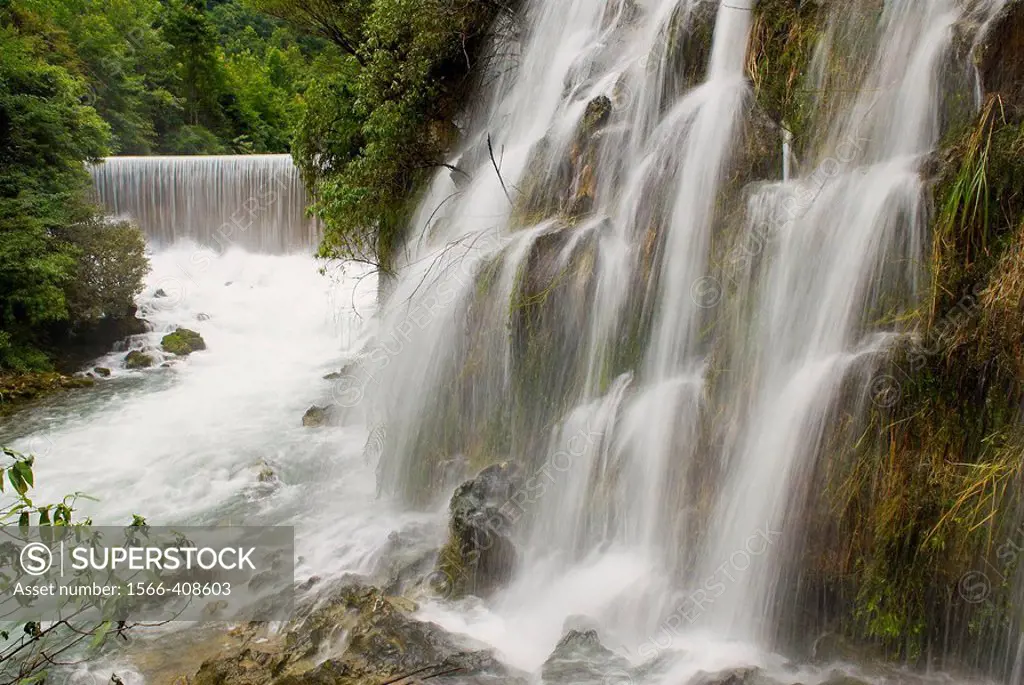 China. Guizhou province. Xiaoqikong rain forest. Waterfall.