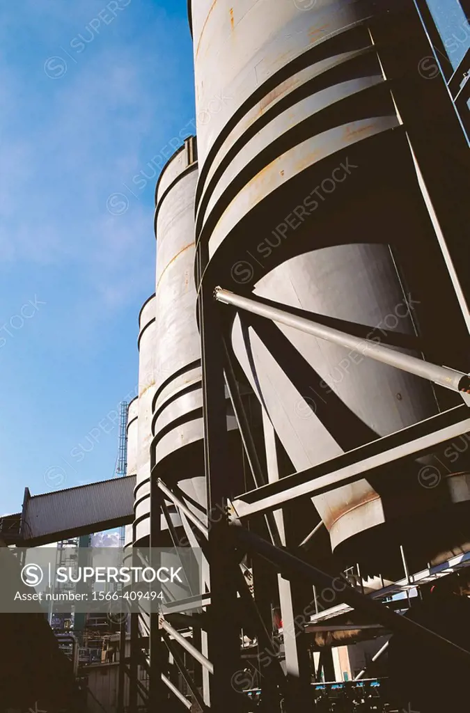 Giant steel hoppers at Harmac pulp and paper mill. Nanaimo, Biritsh Columbia, Canada