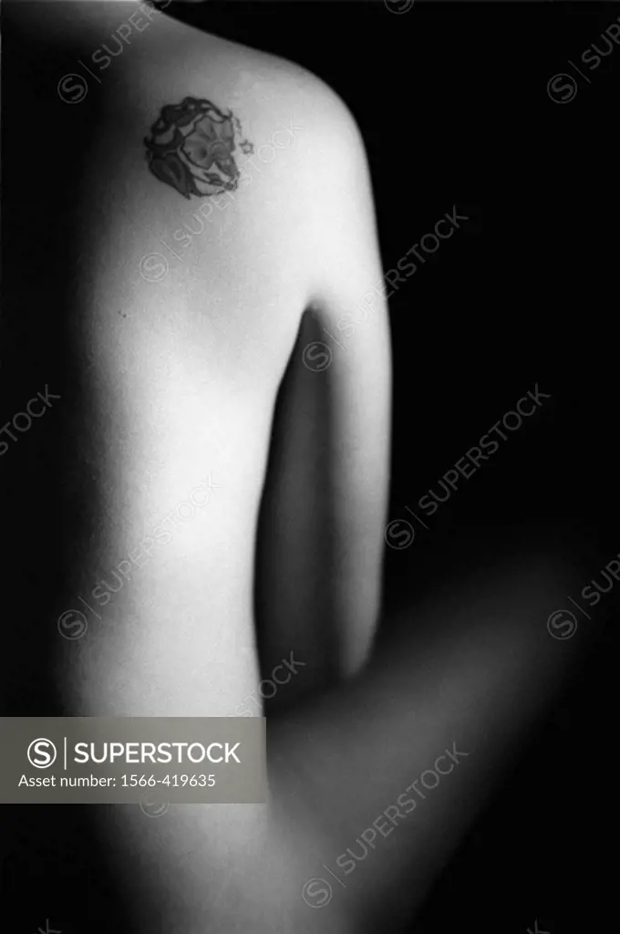 nude young woman with a tatoo