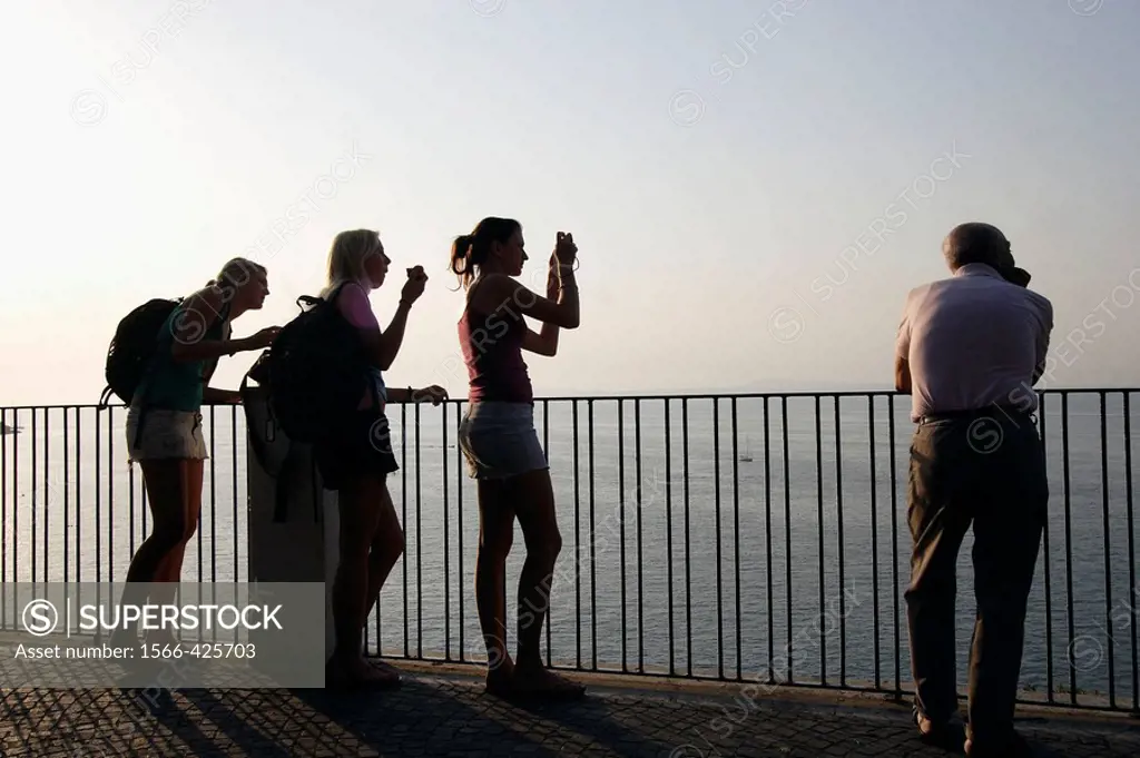 Visitors look at the Sorrento Bay from a lookout from top of the coast cliff. Sorrento. Campania. Italy