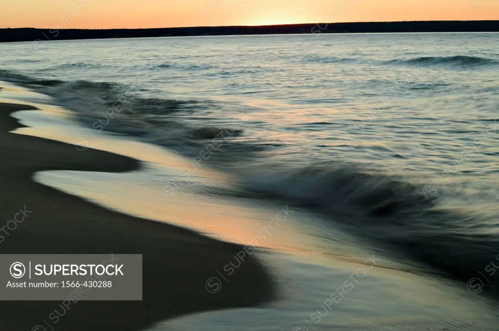 Breaking waves at sunset on the shores of Lake Superior, Upper Peninsula of Michigan, USA