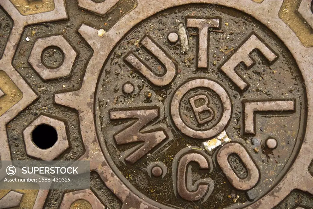 Seattle, Washington, USA: A manhole cover provides an opportunity for gritty street art.