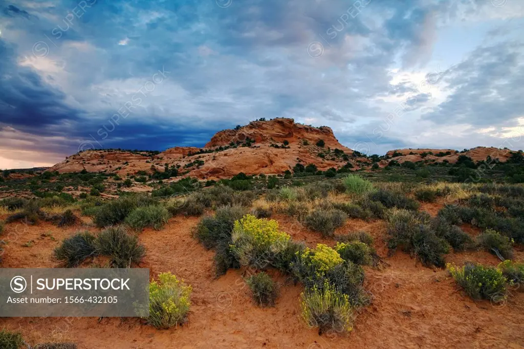 Storm clouds gather over an unnamed sandstone butte in the Sand Flats area east of Moab, Utah, USA