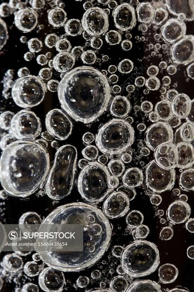 Close-up of air bubbles in glass vase.