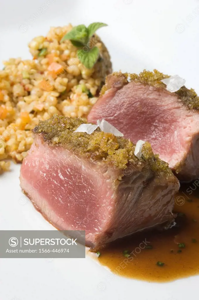 Lamb loin with aromatic herbs and grain couscous at restaurant A Estacion by chefs  Xoan Crujeiras and Beatriz Sotelo, Cambre. La Coruña province, Gal...
