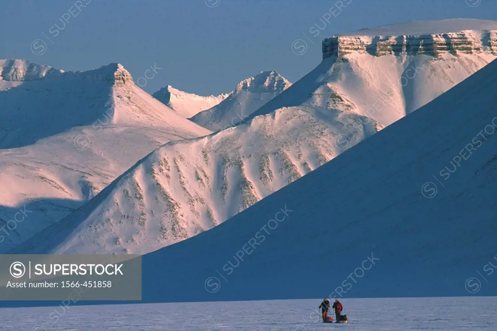 Ski tourers spring ski traverse Ny Alesund to Longyearbyen Spitsbergen Island Svalbard Norwegian Arctic