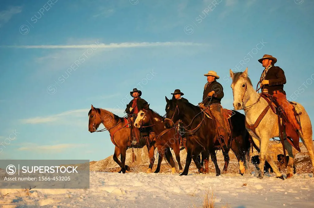 Wranglers out for a ride in the snow, Shell, Wyoming, USA
