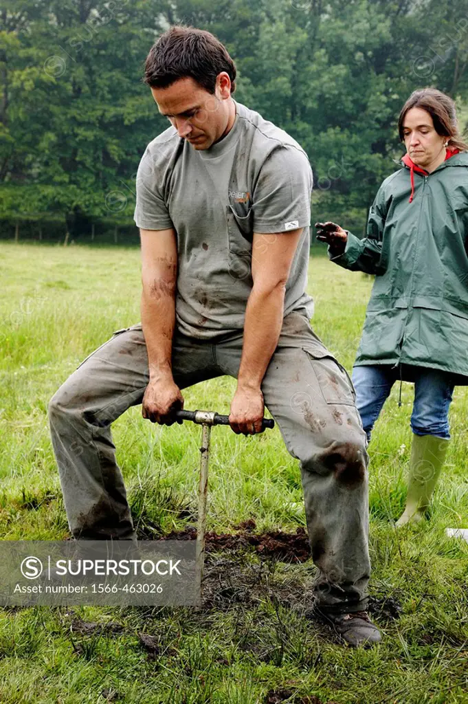 Man using Russian corer to sample peat, climate change research, Neiker-Tecnalia, Unit of Environment, Belate, Navarra, Spain