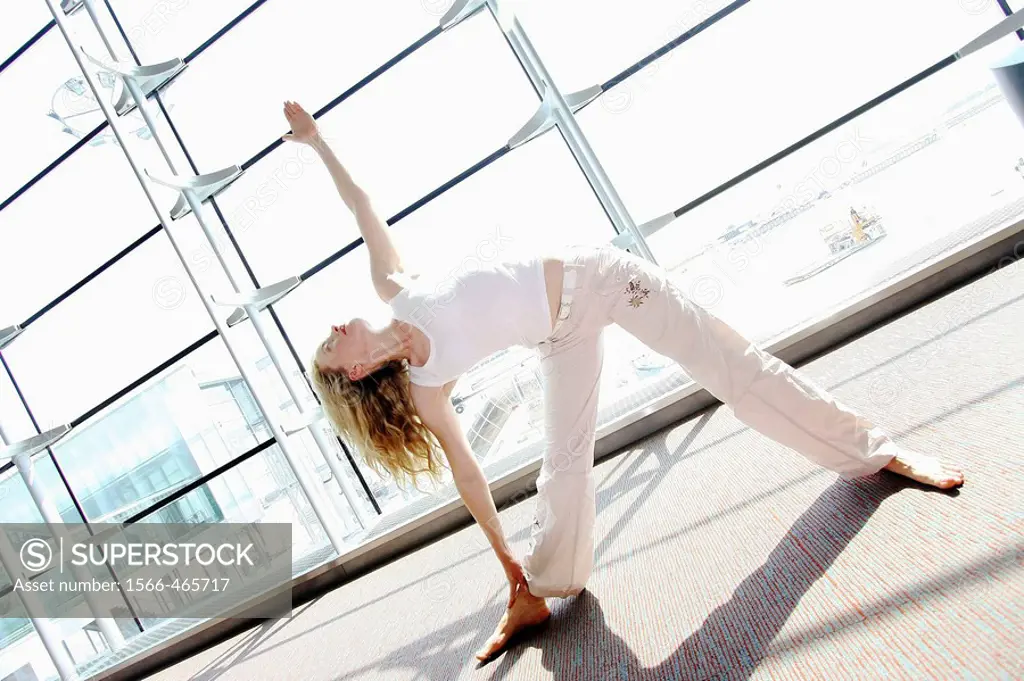 30 year old woman doing yoga