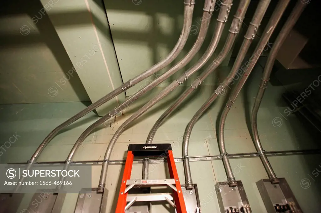 Electrical conduit pipe feeding into electrical room