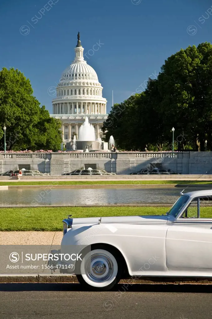 USA, Washington, D.C. A Rolls Royce sits parked in front of the capital building.