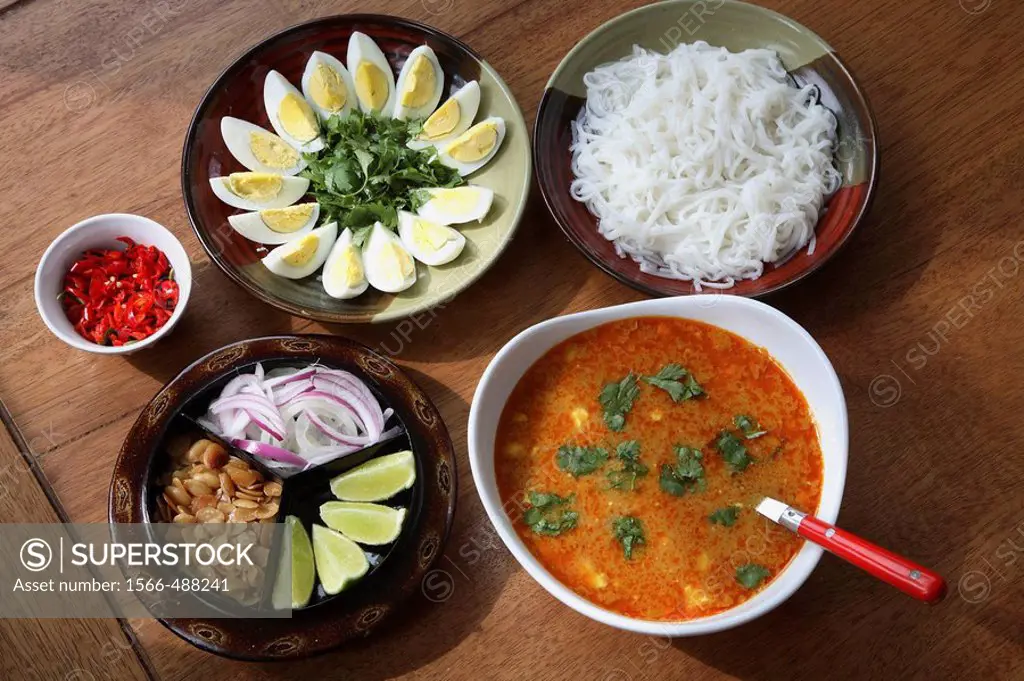 Myanmar, Burmese Mohinga fish soup with side dishes