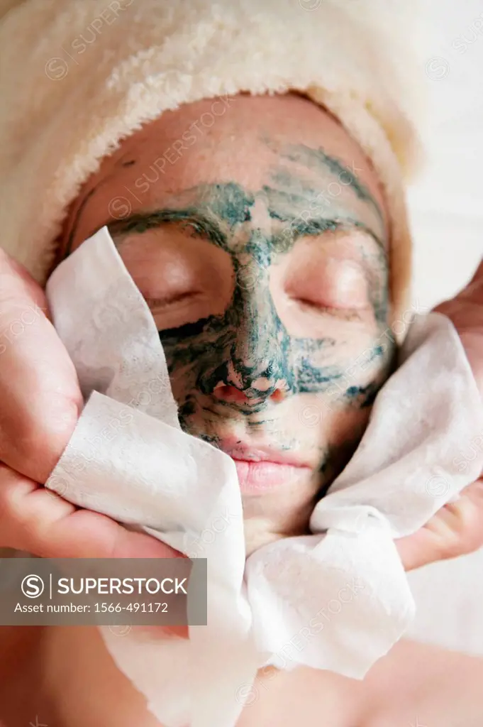 Green clay face skin theraphy massage, woman