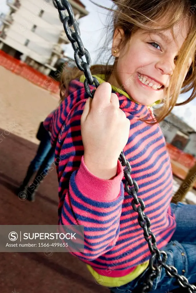 Child on the playground swing