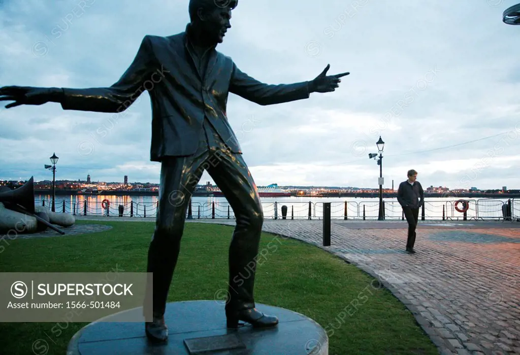 The statue of Billy Fury by Albert dock and the Merseyside river, Liverpool, England, UK