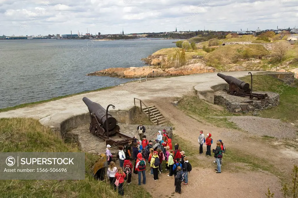 Finland, Helsinki, school classes at the guns of Kustaanmiekka visiting Suomenlinna maritime fortress