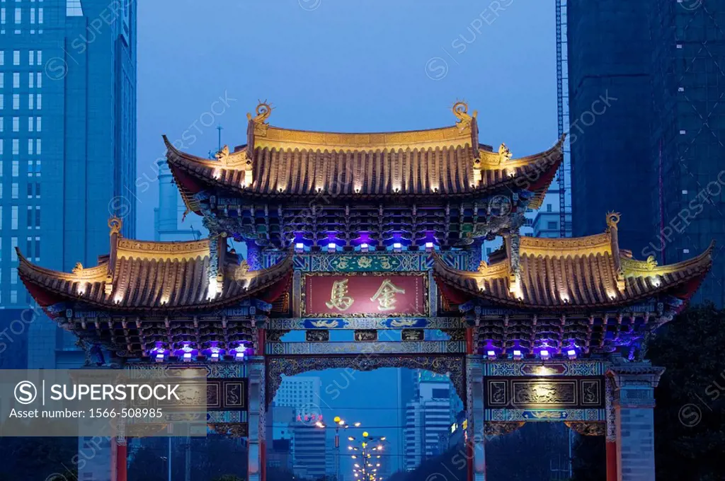 China. Yunnan Province. Kunming: Memorial Arch of the Golden Horse and Jade Rooster in Jinmabiji Square / Evening