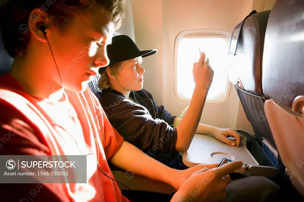 Boys listening to ipods on an Airbus