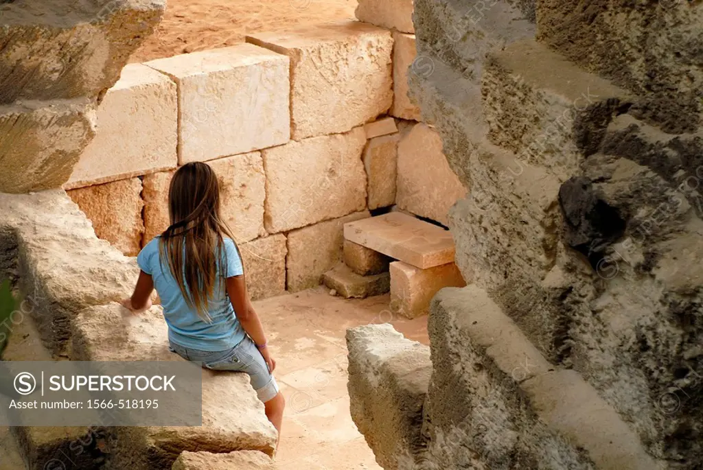 Niña sola entre las piedras   Girl alone among the rocks  Líthica, pedreres de s´Hostal, Menorca, Balears, Spain, Europe
