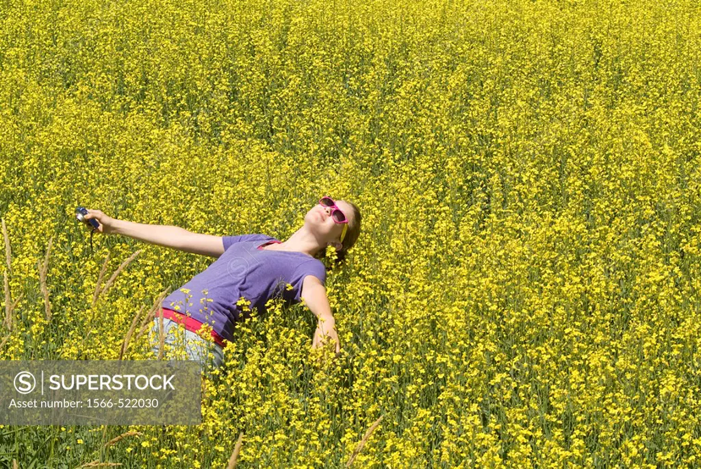 13 year old girl in canola field in British Columbia, Canada